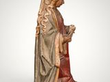 a statue of a woman holding a flower in her hands