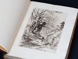 an open book with a drawing of a man in the woods