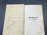 an old book sitting on top of a table with writing on it