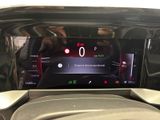 the dashboard of a car with a digital display on it