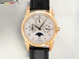 une montre-bracelet en or avec un cadran blanc et un bracelet en cuir noir
