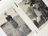 an old black and white photo of a man and a woman on a tripod