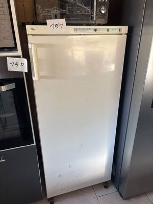 two refrigerators that are sitting next to each other in the kitchen
