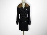 black coat with fur collar and buttons on mannequin base