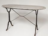an iron table with a marble top on a white background