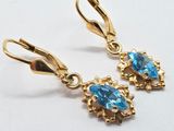 blue topaz drop earrings in 14k yellow gold