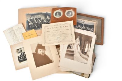 many old photographs of women and men on this table