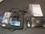 a tablet computer sitting on top of a table next to a tablet computer