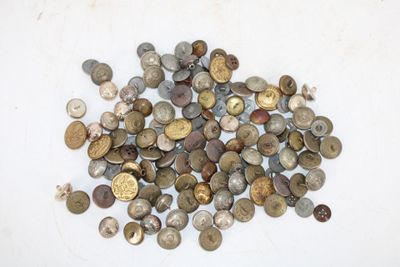 a pile of old coins on a white surface