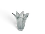 a glass vase that has a spoon and spoon in it