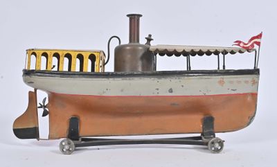 un bateau miniature surmonté d'un drapeau