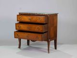 a small chest of drawers with a marble top