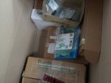 a cardboard box with many items inside of it
