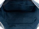 the inside of a blue handbag with a zipper on it