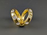 an image of a gold ring with diamonds on it