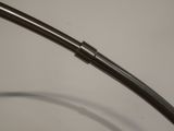 a close up of a curved metal object on a table