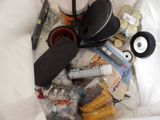 a white bag filled with various items that include a hat and other items