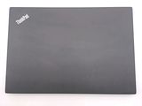 a laptop that is sitting on a white surface