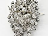 une image représentant une broche ornée d'un bouquet de fleurs