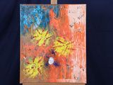 a painting on a easel with a black background