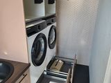 a washer and dryer in the corner of the room