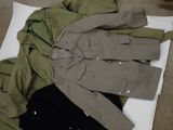 a jacket and pants laid out on the floor