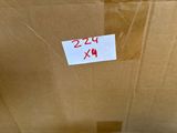 a cardboard box that has a sign on it