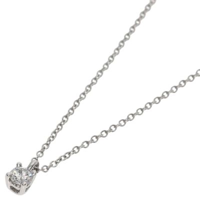 a close up of a diamond heart pendant on a chain