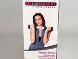 a box with a picture of a woman holding a pair of dumbbells