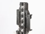 a metal object that is sitting on a white surface