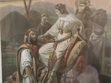 painting of a man sitting on a horse in front of a group of people
