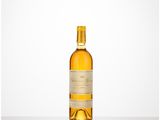 a bottle of white wine sitting on top of a table