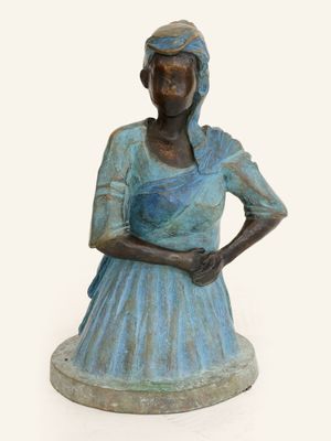 bronze statue of a woman in a blue dress with her hands on her hips