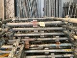 a large pile of pipes and pipes in a room