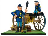 figurines of two police officers with a cannon and a cannon
