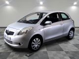 a picture of a silver toyota yaris parked in a garage