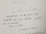 an old black and white photo of a handwritten letter on a piece of paper