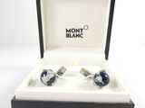 pair of blue and white cufflinks in a black box