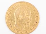 an image of a gold coin with a man ' s face on it