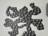 a drawing of a bunch of grapes on a cutting board