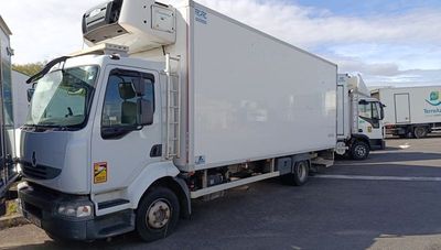 a white truck that is parked in a parking lot