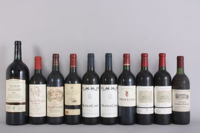 several bottles of wine are lined up in a row on a table
