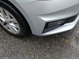 a silver car that is parked in a parking lot