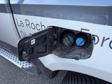 a gas pump attached to the side of a car