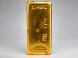 a gold bar on a white background
