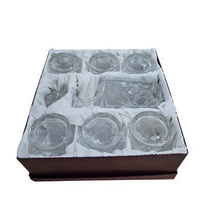 a box that has a lot of empty glasses in it