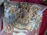 a bag full of pearls and other items in it