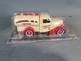 a toy truck that is in a clear plastic case