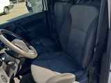 the interior of a white van with a black seat and steering wheel