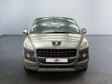 a silver car parked in a room with a black floor